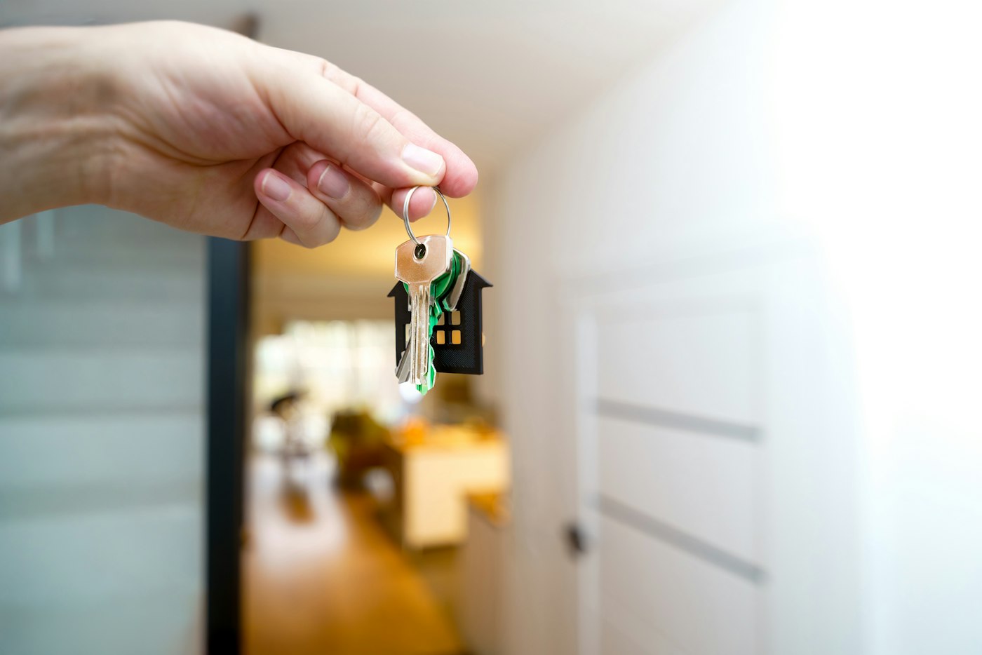 Holding keys in front of a property entrance