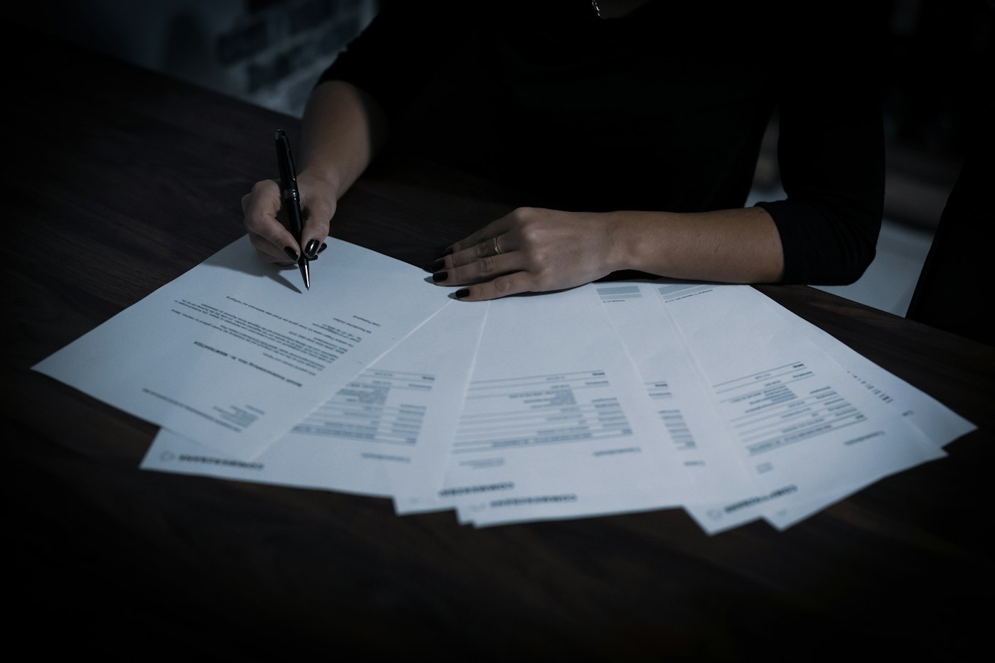 Business owner working through financial paperwork
