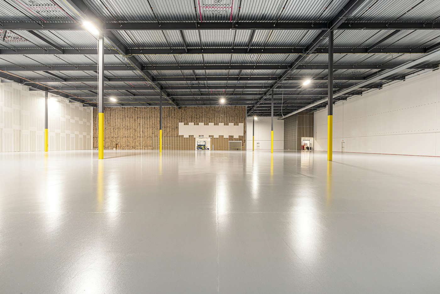 Empty warehouse with a polished concrete floor